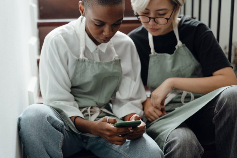 Two women watching an interactive video